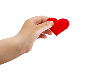 Child's hand holds a red heart isolated on a white background.
