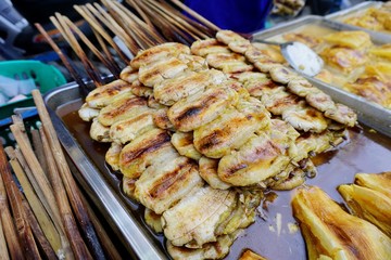 Grilled banana skewers at street food.