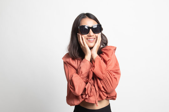 Portrait of a beautiful young asian girl in sunglasses .