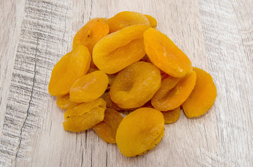 dried apricots on a wooden table. close-up.