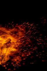 flame of fire with sparks on a black background