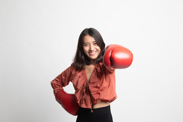 Young Asian woman with red boxing gloves .