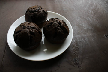 Chocolate cupcakes on a white plate