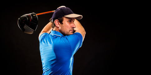 Portrait of a golf player perfecting the swing isolated on dark background, banner image