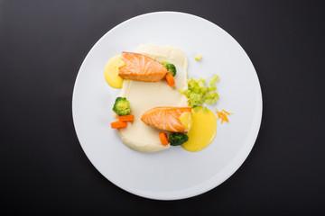 Fried salmon fillet with vegetables