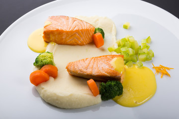 Fried salmon fillet with vegetables