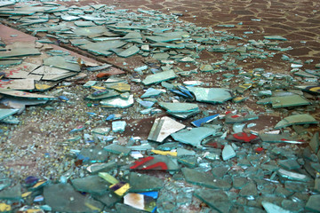  broken window panes on the floor

