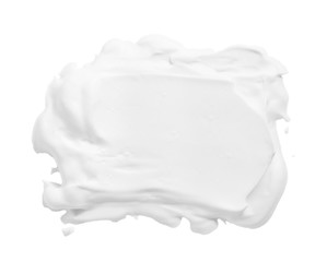 White mousse foam creamy texture. Cosmetic cleanser, soap, shampoo sample isolated on white background. Foamy skincare product smear smudge