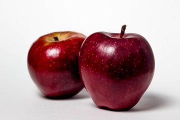 Two apples lie on a white background