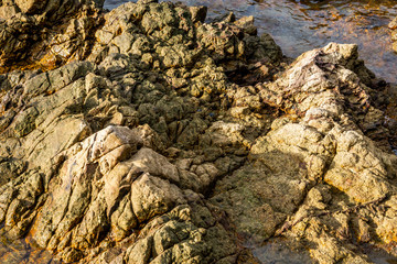 Large boulders on the sea coast. Beautiful rock pattern on the beach landscape. Many stone under the clear sea. Panoramic view, travel location. Beauty in nature. Krating Bay, Chanthaburi ,Thailand.