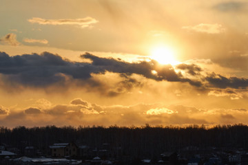 Obraz premium Beautiful landscape of orange evening sunset in the sky with clouds. The concept of the natural environment