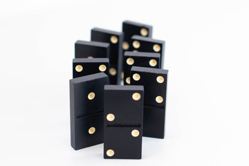 Domino bones stand upright, white background. Concept of choice