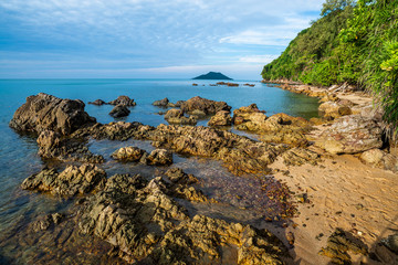 Beach and Large boulders on the sea coast. Beautiful rock pattern on the beach. Blue sea and blue clear sky. Panoramic view, travel location. Beauty in nature. Krating Bay, Chanthaburi ,Thailand.