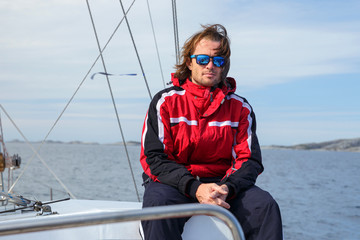 A yachtsman on the fishing boat in open sea in Norway