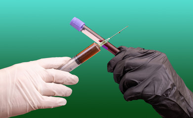 The syringe with vaccine against Covid-19 virus and the test tube with blood are in the hands of the doctor and form a cross. The concept of stopping the spread of Coronavirus