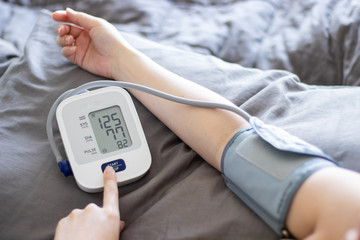 Measuring blood pressure at home with portable device, health check