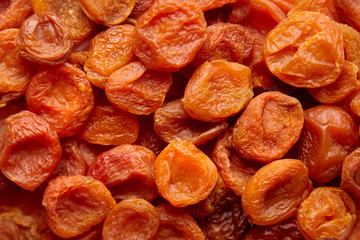 Dried apricots background. Heap of dry apricot fruits