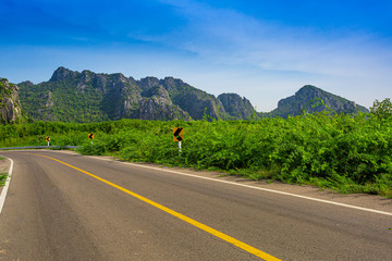 Asphalt highways and mountains under the blue sky,Road mountains sky asphalt