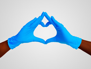 heart made blue nitrille glove. Medic's hands
