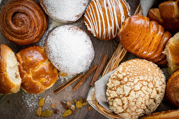 Fresh bakery, sliced bread on a wooden backround