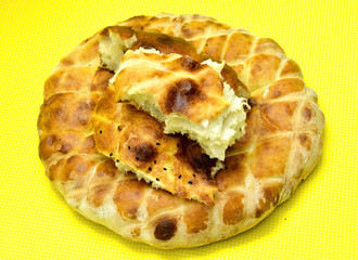 fresh baked bread isolated on yellow background