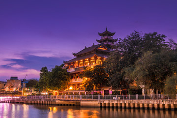 Night scene of Phap Hoa pagoda along Nhieu Loc canal (Saigon river) at night in Ho Chi Minh City,...