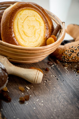 Fresh bakery, sliced bread on a wooden backround