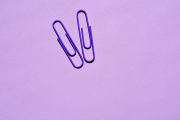 paper clip on purple background