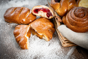 Fresh bakery, sliced bread on a wooden backround