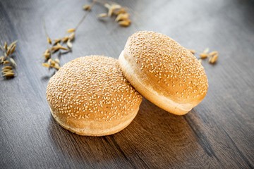 Fresh bakery, sliced bread on a wooden backround