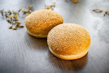 Fresh bakery, sliced bread on a wooden backround