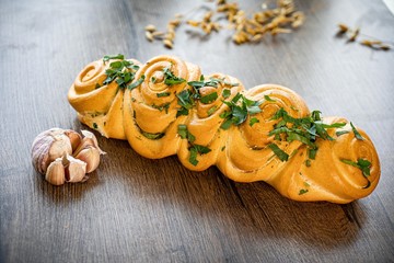 Fresh bakery, sliced bread on a wooden backround