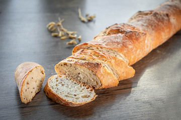 Fresh bakery, sliced bread on a wooden backround
