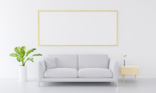 Interior poster golden photo frame mockup  on the shelf with small plant in pot and desk lamp on empty white wall background. . 3D rendering, illustration.