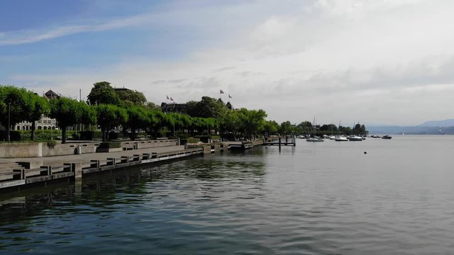 Drone Shot of Empty Lake Promenade During a Sunny Day in Z&uuml;rich Switzerland - Slowly Moving Upwards