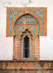 Mudejar style window with tiles -alicatados- of the church of Omnium Sanctorum in Seville, Spain