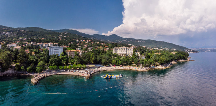 Beautiful panoramic view of Lovran village and its sea shore in Croatia. Top view photo taken on drone.