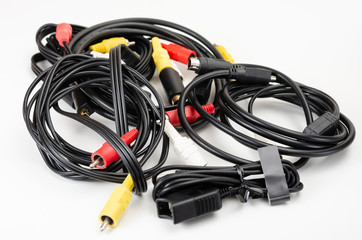 Close-up  pile of analog  rca cables  for connection between camcorder, dvd player, blu-ray on white  background.