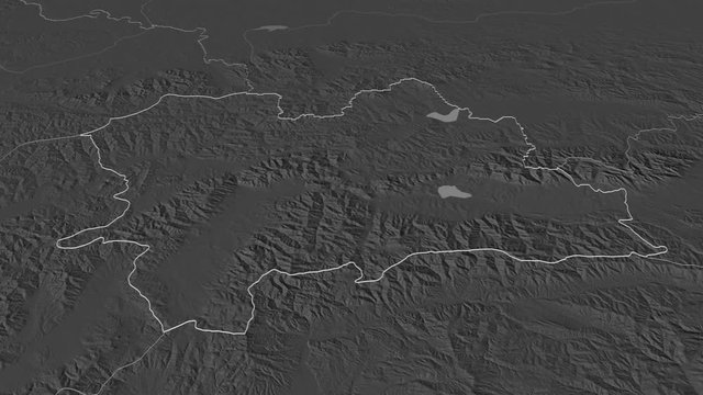 Žilinsk&yacute;, region with its capital, zoomed and extruded on the bilevel map of Slovakia in the conformal Stereographic projection. Animation 3D