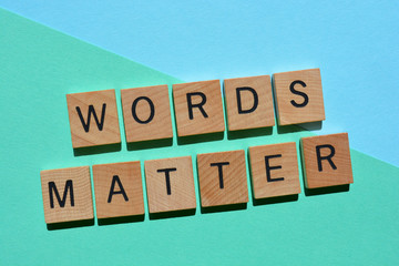 Words Matter, phrase in wooden alphabet letters on turquoise
