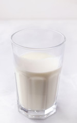 Fermented milk drink kefir on a white background. Vertical photo