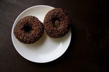 Chocolate donuts on a white plate
