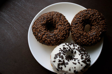 Chocolate donuts on a white plate