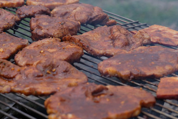 Grilled meat on the barbecue. Food background selective focus.