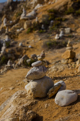 Beach with stacks of rocks called a cairns. Peniche Portugal