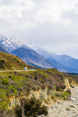 Naklejka na ściany i meble Highway in the Southern Alps along the shores of Lake Pukaki. South Island, New Zealand