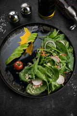 A fresh, healthy salad with zoodles zucchini noodles, baby tomatoes, avocado