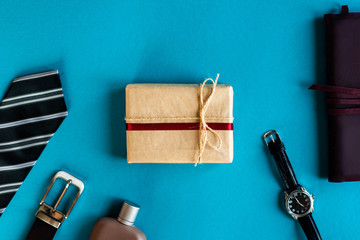 Set of stylish men's accessories and gift box on a blue background, flat lay Desktop. Happy father's day. 19 june