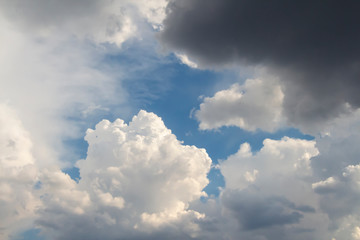 Dramatic sky with cumulus clouds before rain. Blue sky around fluffy cloud. Beautiful landscape. Heaven theme.
