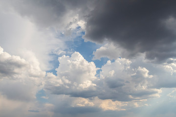 Dramatic sky with cumulus clouds before rain. Blue sky around fluffy cloud. Beautiful landscape. Heaven theme.